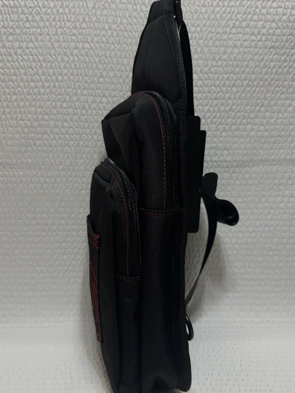True religion travel sling black bag red horseshoe front
